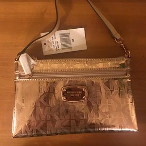 Michael Kors rose gold wristlet